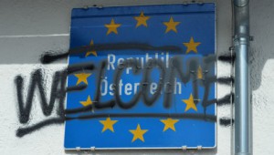 "Welcome" is painted to the Austrian Border sign after protests in the village of Brenner on the Italian-Austrian border, Sunday, April 3, 2016. Austria's defense minister said his country will deploy soldiers at a key Alpine pass to stop migrants arriving from Italy. Hans Peter Doskozil told German daily Die Welt that the move anticipates a shift in migrant flows from the Turkey-Greece route to the central Mediterranean. In an interview published Saturday, the newspaper quotes Doskozil saying that the military can provide "considerable support to border security" at the Brenner pass. (AP Photo/Kerstin Joensson)